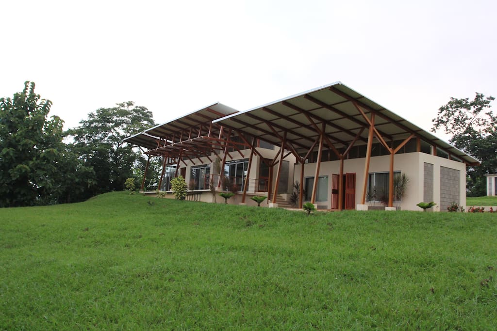 Huge grassy area surrounds the house