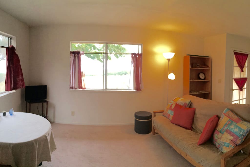 Living Room and Sitting Area - Enjoy view of ocean and green hills from window