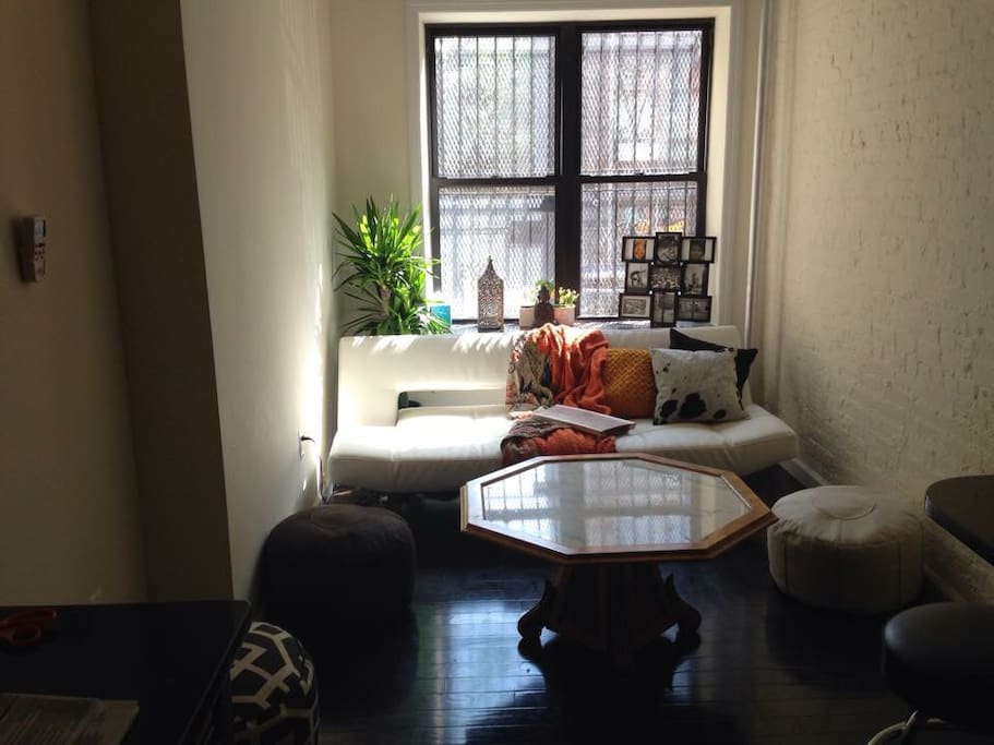 Double size futon , convertible. Living room with bar stool