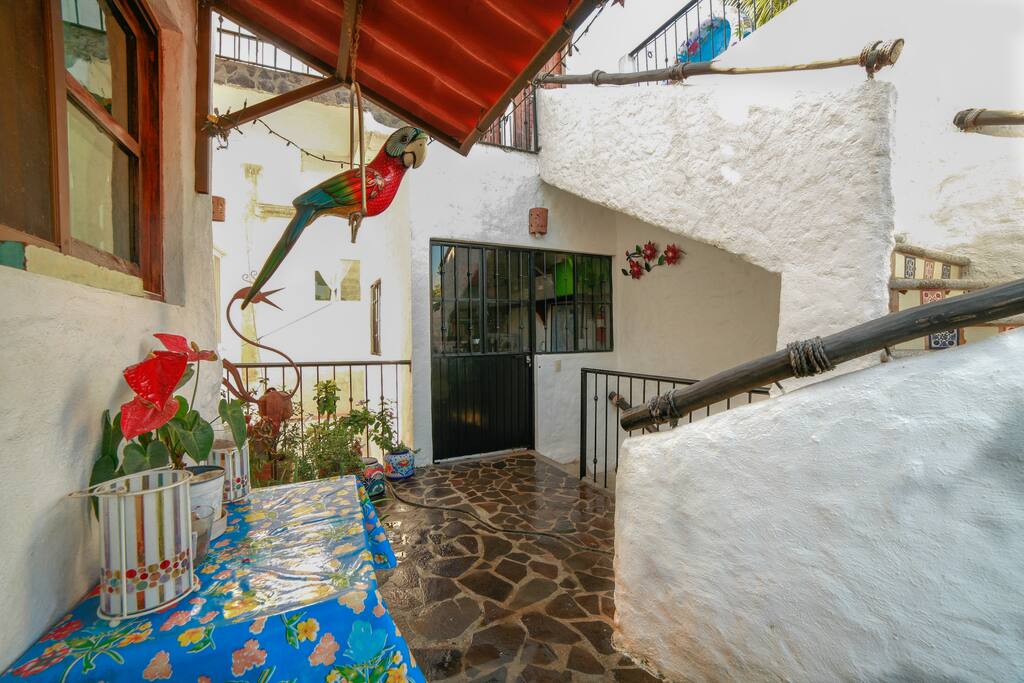Second floor balcony leading up to rooftop terrace.