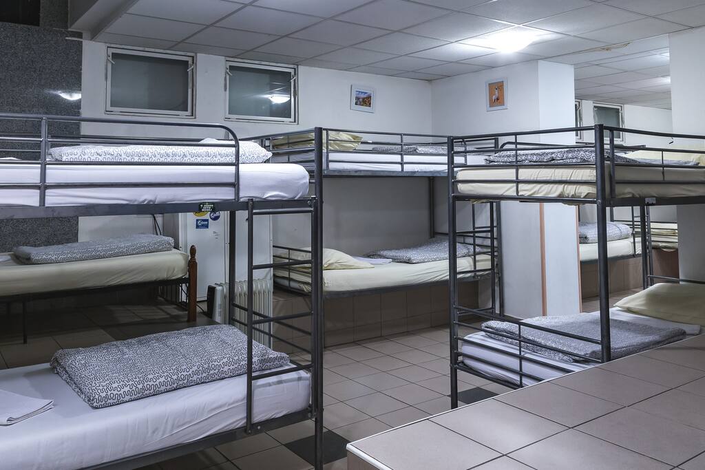 Our dormitory with 12 beds offers you outlets, two bathrooms with showers and lockers for your valuables and some personal space as well!