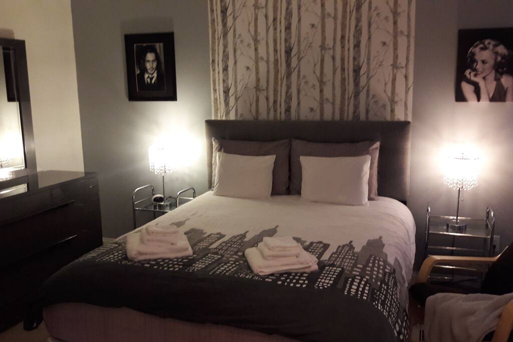 Elegant master bedroom with very comfy queen size bed.