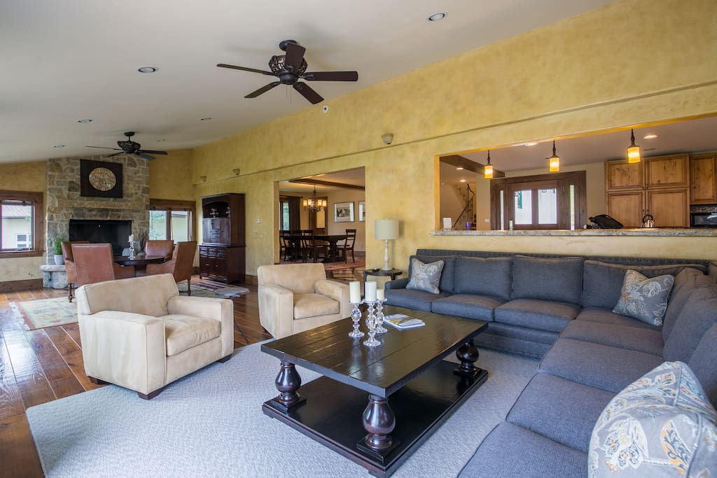 Plush armchairs and an L-shaped sofa offer comfy seating.