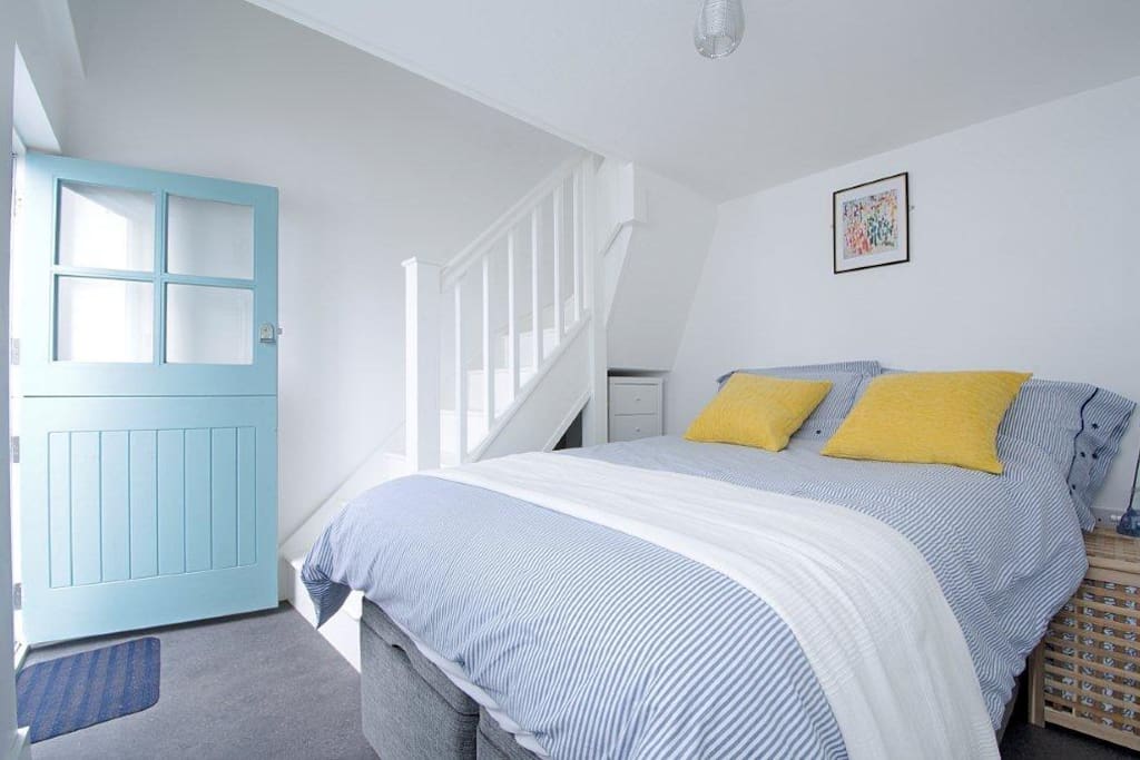 Storage drawers are tucked away beneath the stairs
