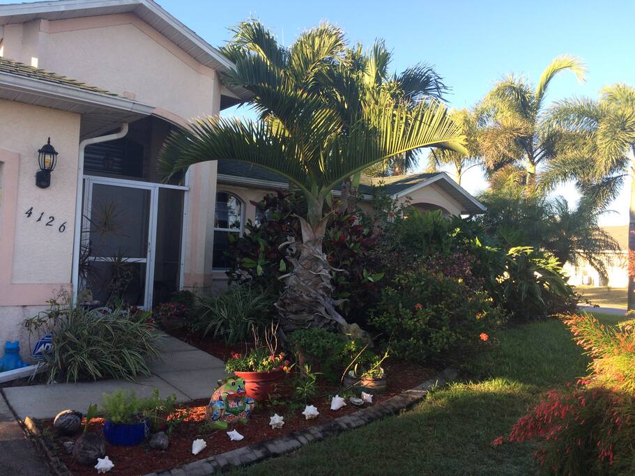 Front entrance with lush gardens