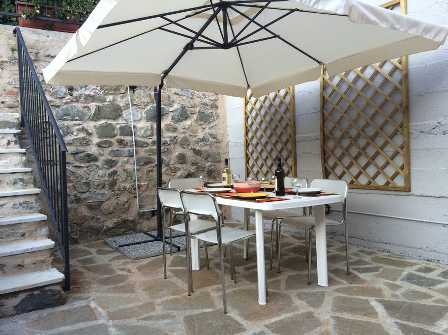 Spacious and maintenance free cobblelocked rear garden with beautiful stone wall, access to rear entrance via stairway, surrounding railed and flower area and plenty outside eating area and facilities.