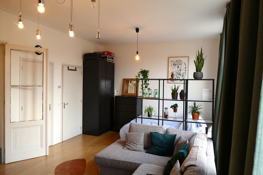 Bright urban living room with double bed