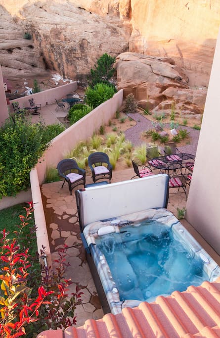 View of our large private hot tub and patio from the upper deck.