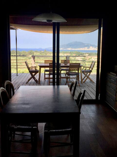 Wooden house in the scrubland, sea view