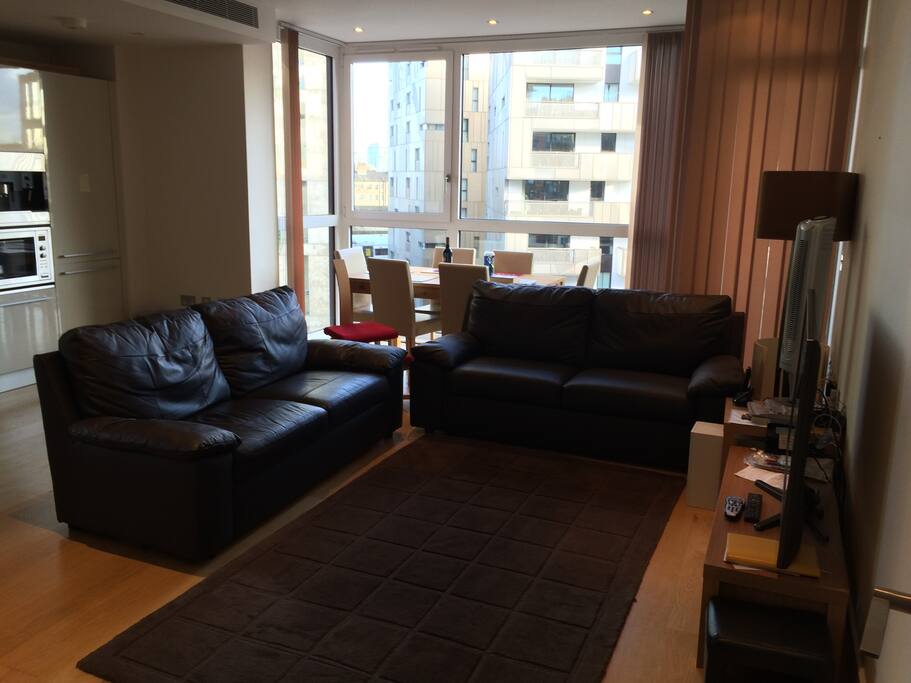 Two large sofas with large flat screen TV