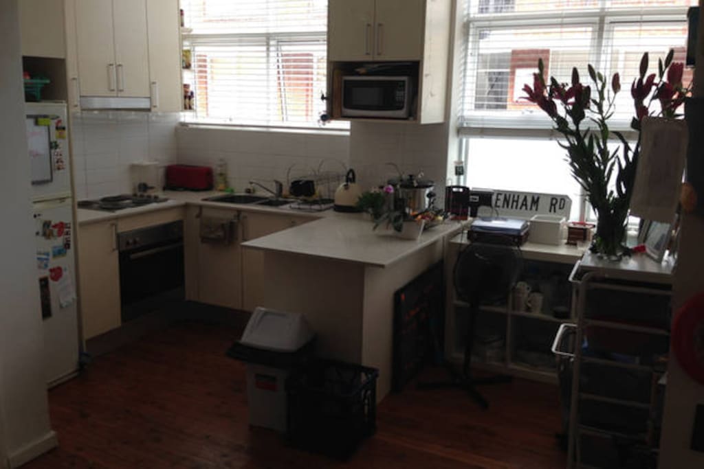 Kitchen/Living Space. Oven, stovetop, fridge (with space for you!). All cups/plates condiments etc are for your use.