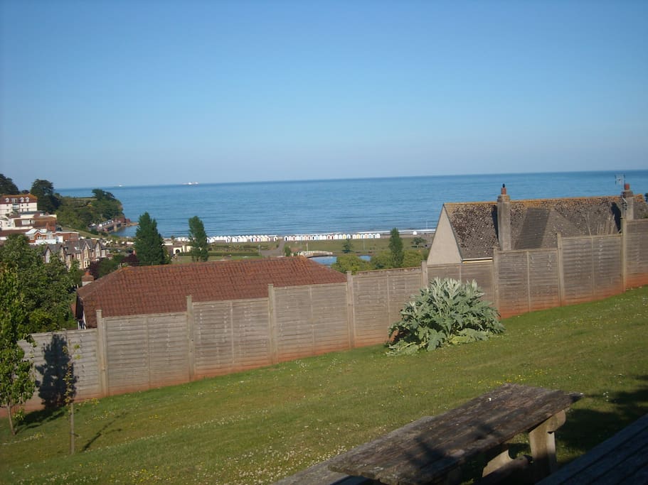 large garden area with BBQ with lovely sea views.