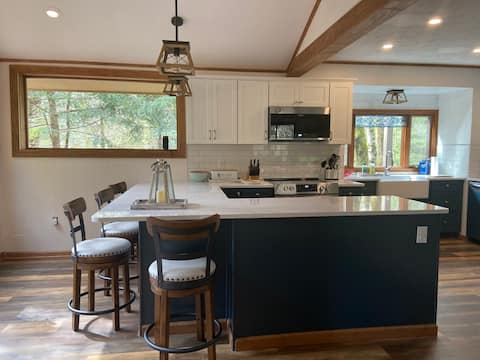 Modern stream-front home with hot tub and air con