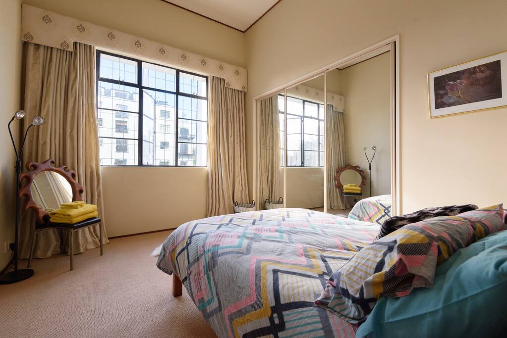 Your room is spacious and welcoming, with further views of Auckland City and Myers Park.