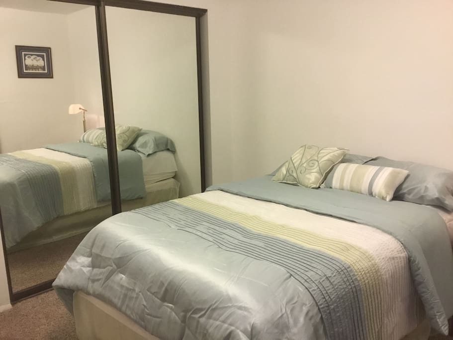 Full size bed with mirrored and large closet.