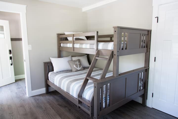 Bedroom 4: Twin over full bunk bed with closet and dresser. Stacked washer/dryer and vacuum are also located in the closet.