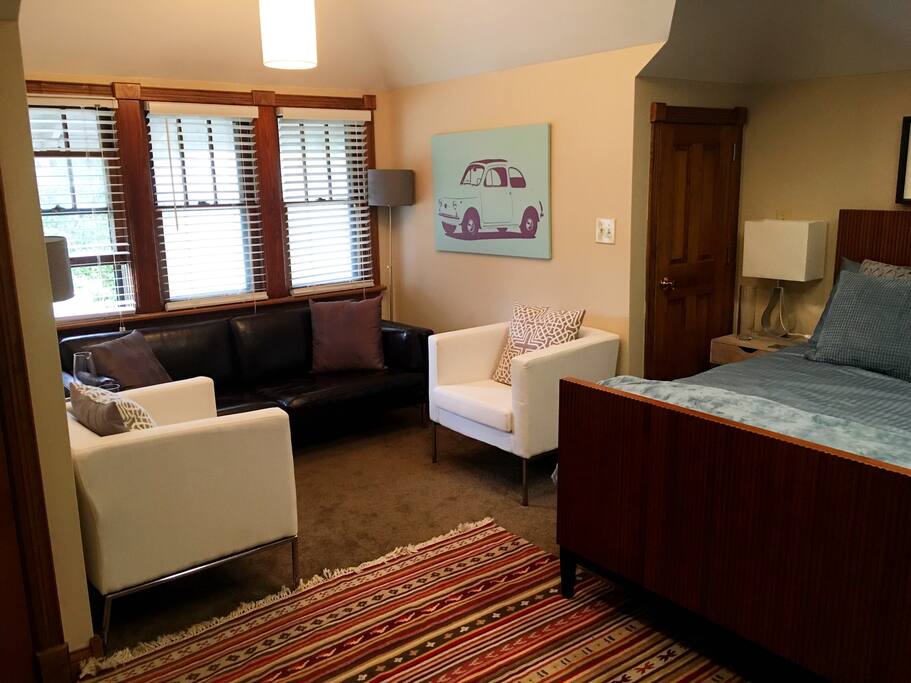 The bedroom has a a living room space.