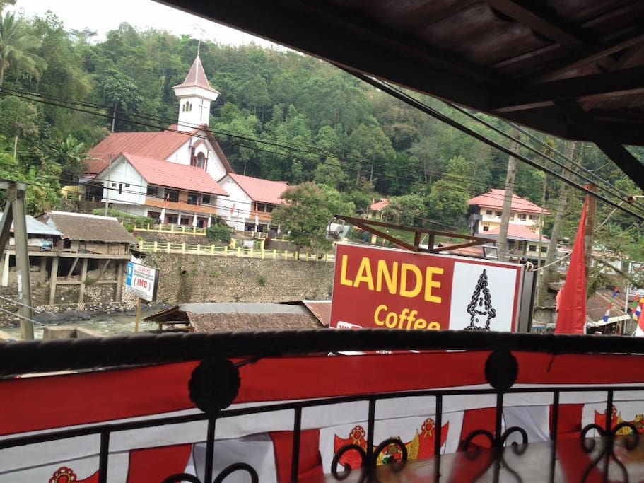 On The Main Street, the right side, in front of the bridge..