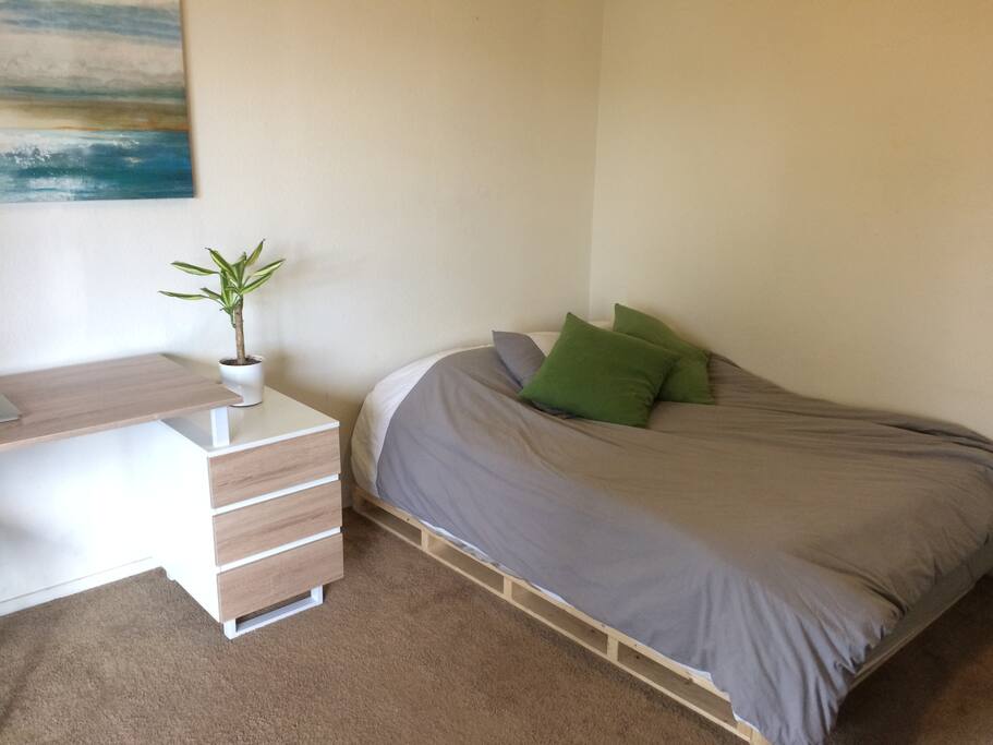 minimalist bedroom with balcony access.