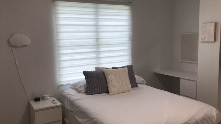 Third room with queen bed.