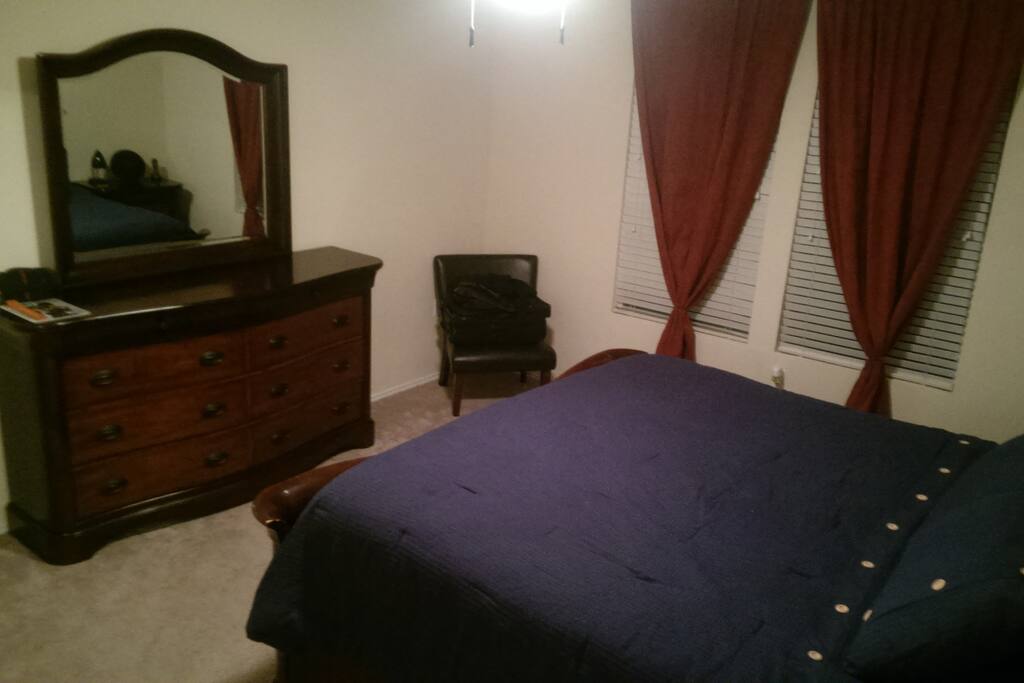 Master bedroom has a comfy king bed.
