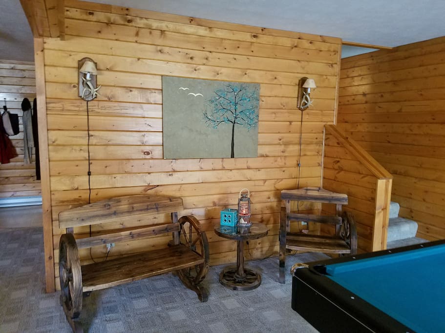 Downstairs den with pool table, 2 futons, and cable TV