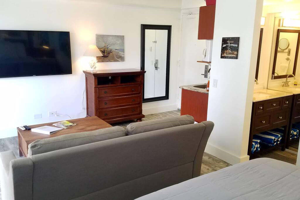 Enjoy the flat screen from bed or the sofa
