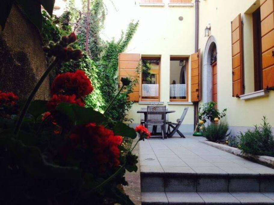 Entrance to the building and courtyard table