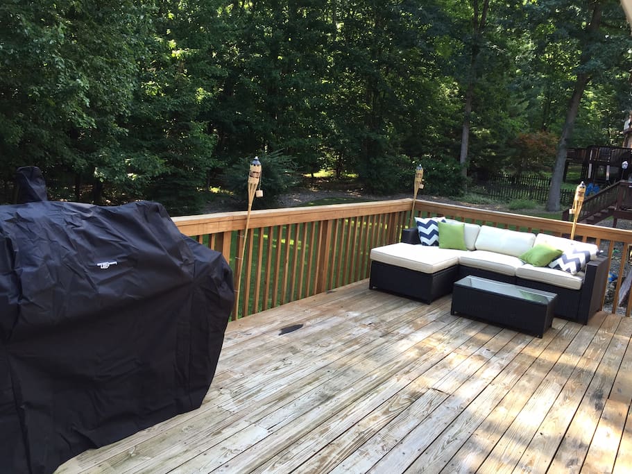 Back deck features grill/smoker and sectional - with room to spare.