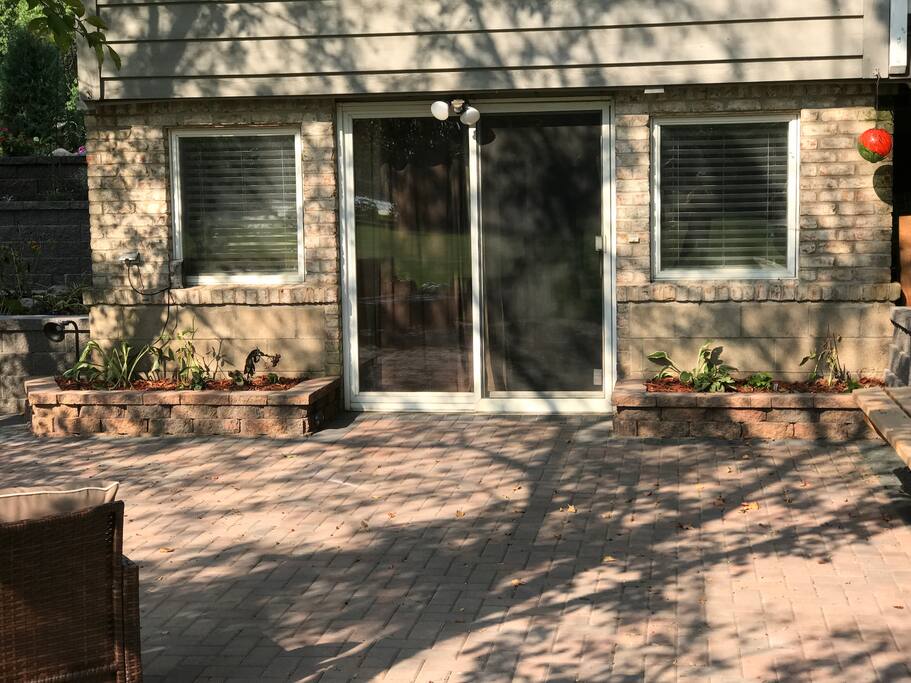 Entrance into apartment through sliding glass door.