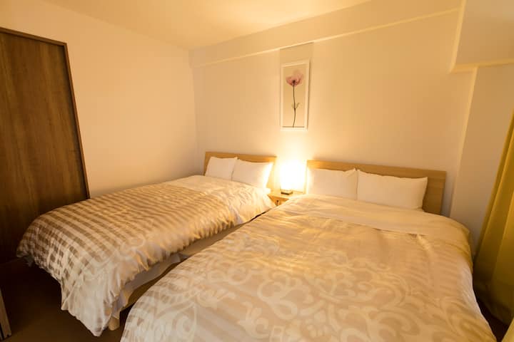 Western bedroom with 2 comfy semi double beds