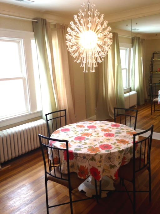 Dining Room- seats 4, you're going to want to get your dance on with the groovy mirrored wall and light fixture!