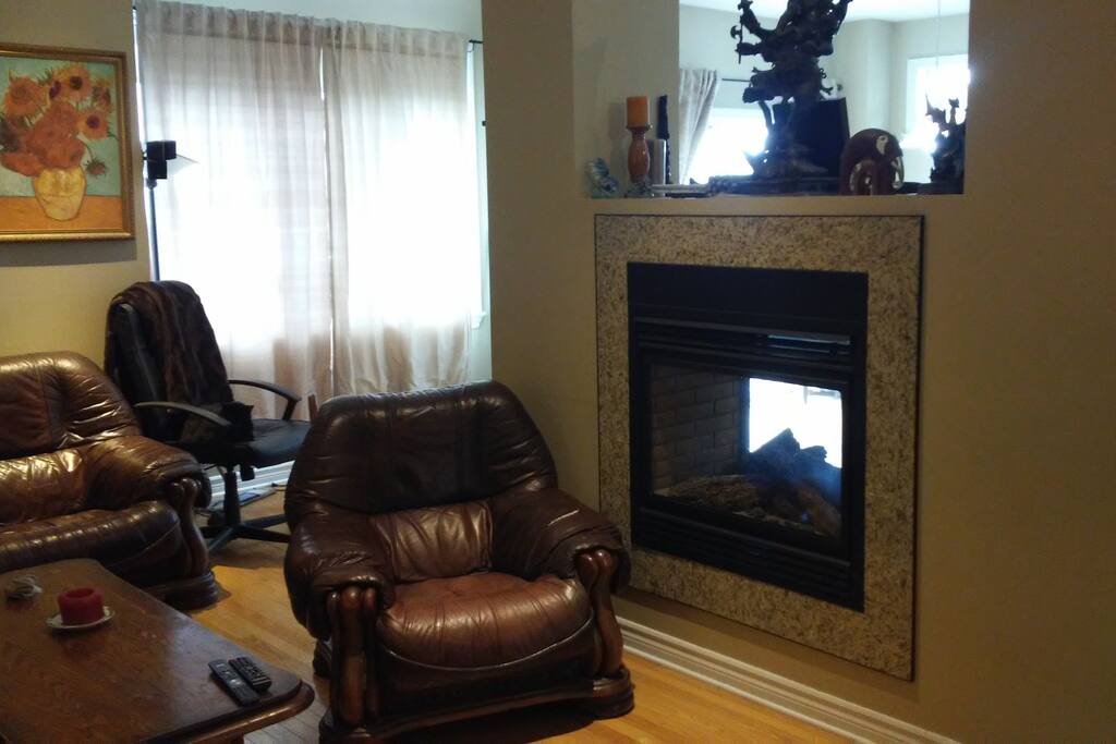 comfy leather chairs; two-way fireplace