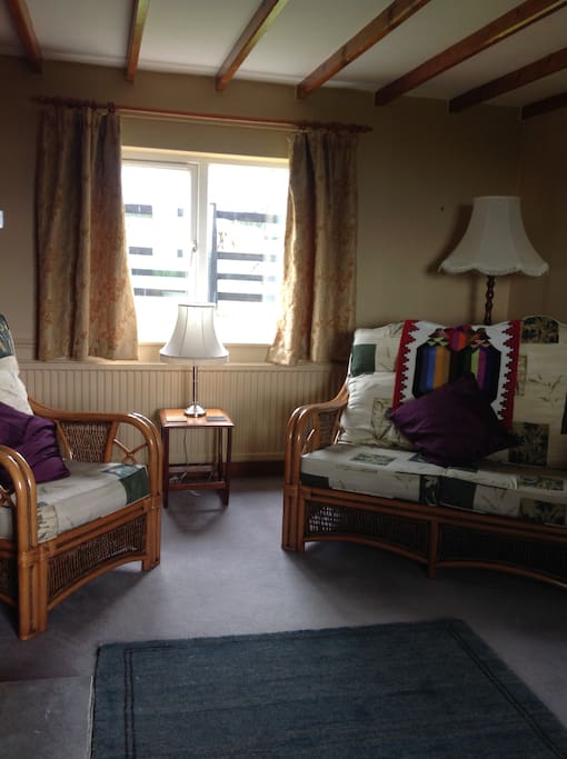 Dual aspect sitting room looking onto paddock