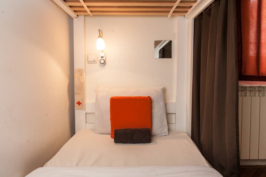 Every bed equipped with it's own charging station, reading light, storage pouch, mirror, and privacy curtain.