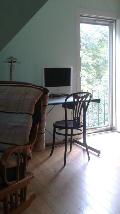 The outer glass door opens to the fire escape.