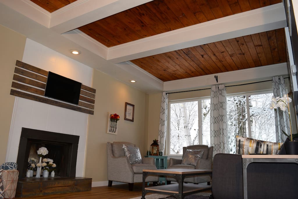Original tongue and groove ceilings add warmth and character to the living room.