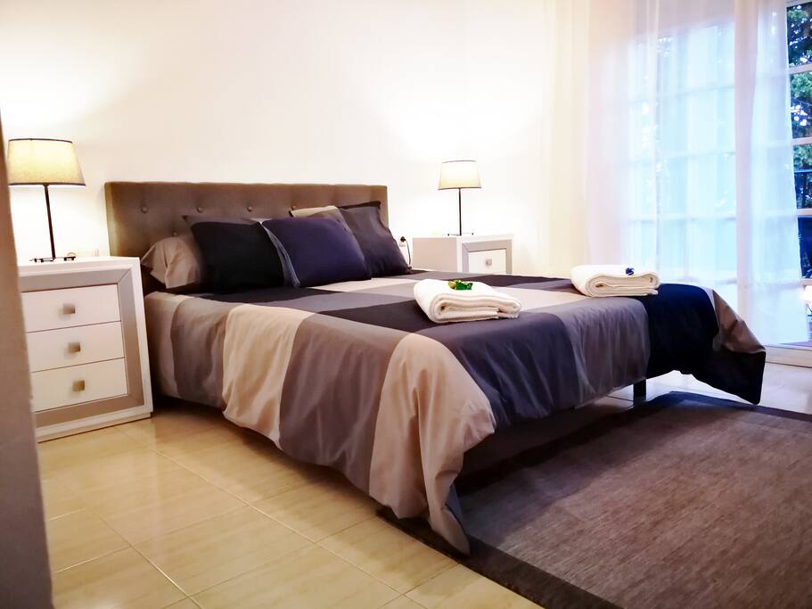 Main bedroom with queen size bed and private balcony