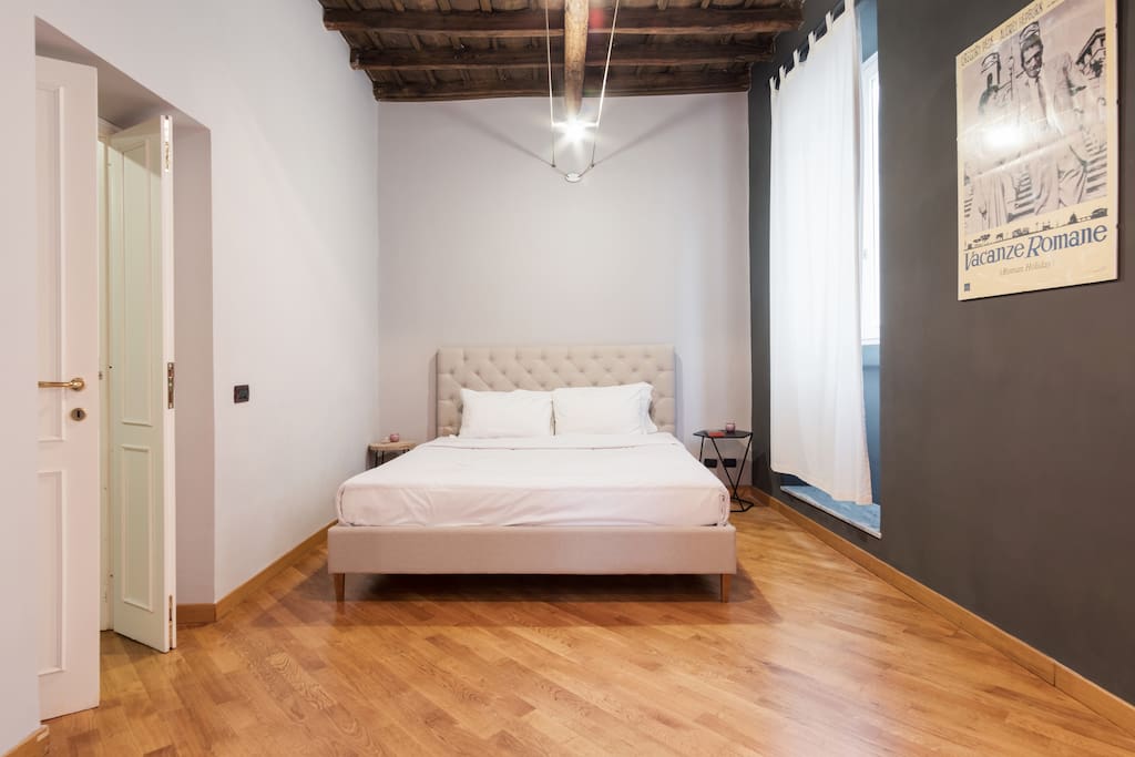 The master bedroom has windows with views of via del Governo Vecchio