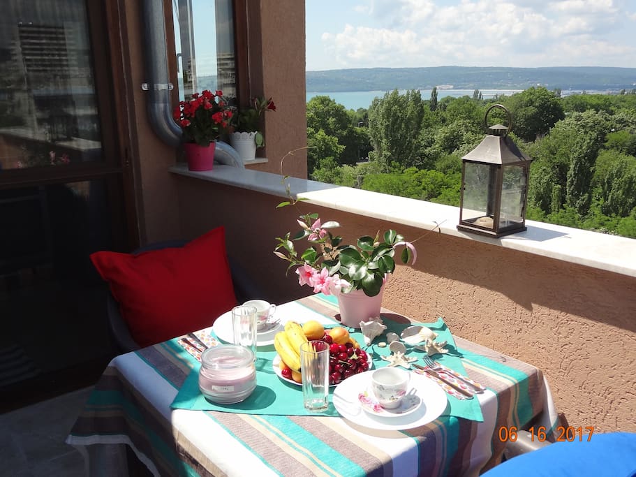 There is table and chairs on the balcony
