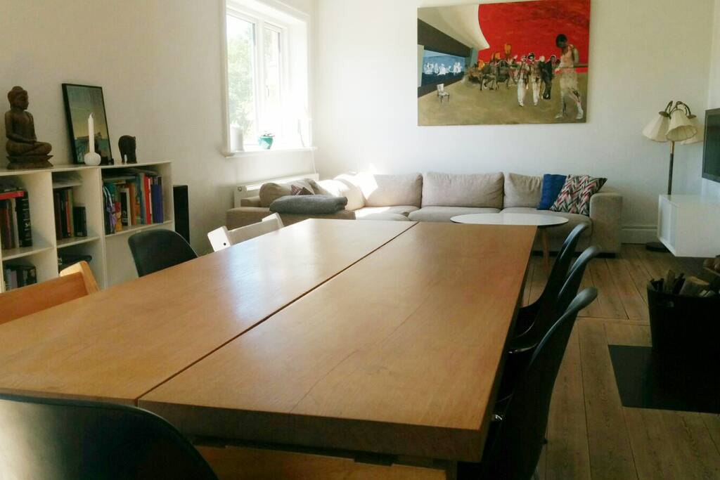 Living and dining room with large 8 persons dining table.