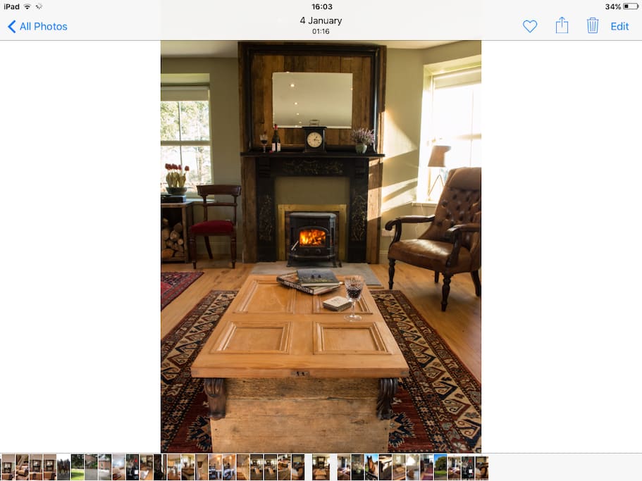 Victorian fireplace surrounds a wood burning stove .