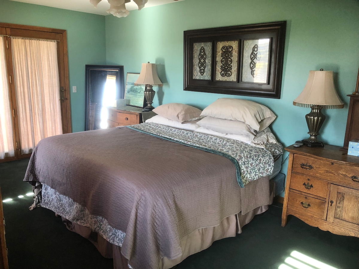 Master bedroom with king size bed and en suite bath