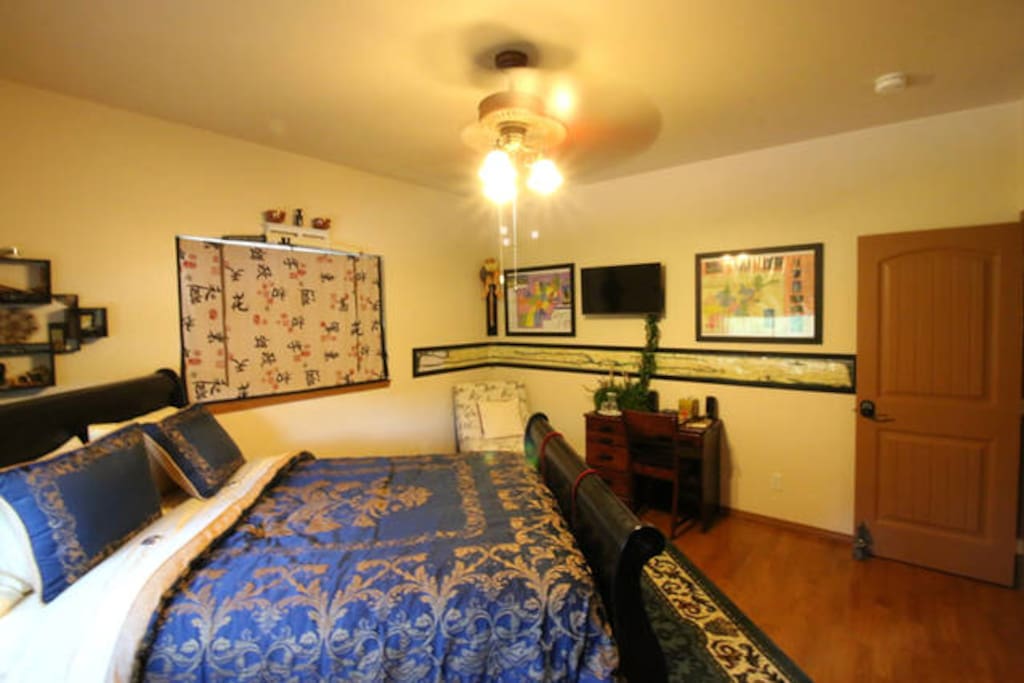 The Eastern room has a writing desk, smart TV, easy chair and wonderful bed.