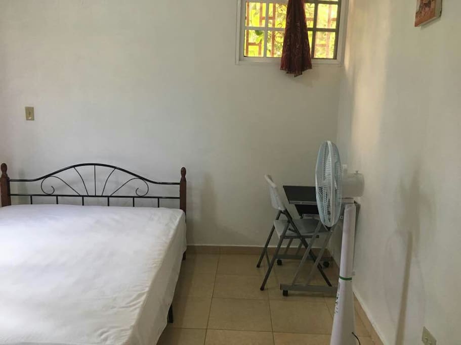 Fully furnished room: laptop table, fan, a queen bed, wardrobe