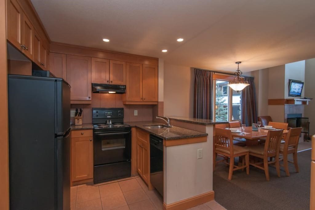 The open-plan kitchen and dining area feature modern amenities.