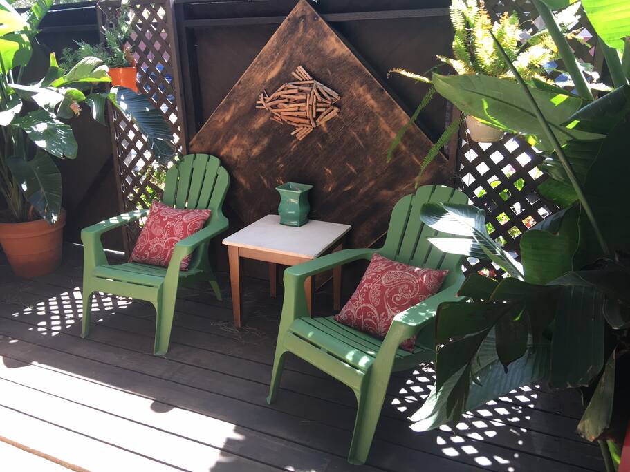 Your own private deck with chairs and a comfortable couch.