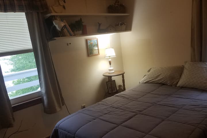 Wake up to a lake view in this main floor bedroom, full size bed