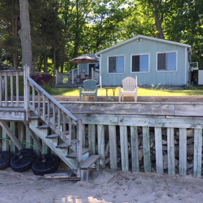 View of front of cottage from beach