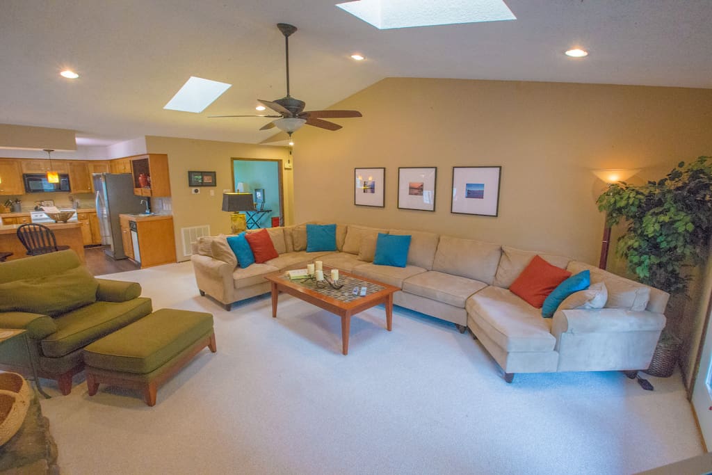 The sofa is HUGE! Also features a queen sleeper! Two skylights and a ceiling fan add to this great room!